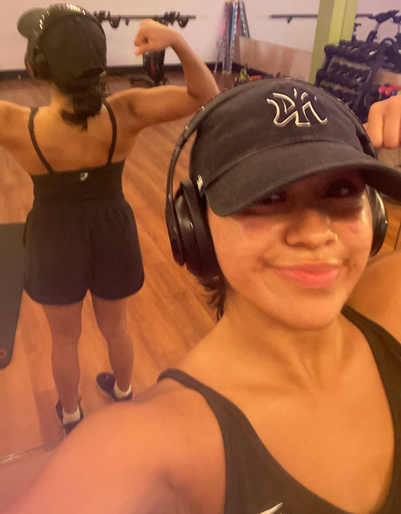 Client progress photo showing Laisha after body recomposition coaching